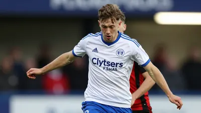 Ballymena United suffered a 2-1 loss to Crusaders, with Owen Wardell's exceptional performance for the visitors